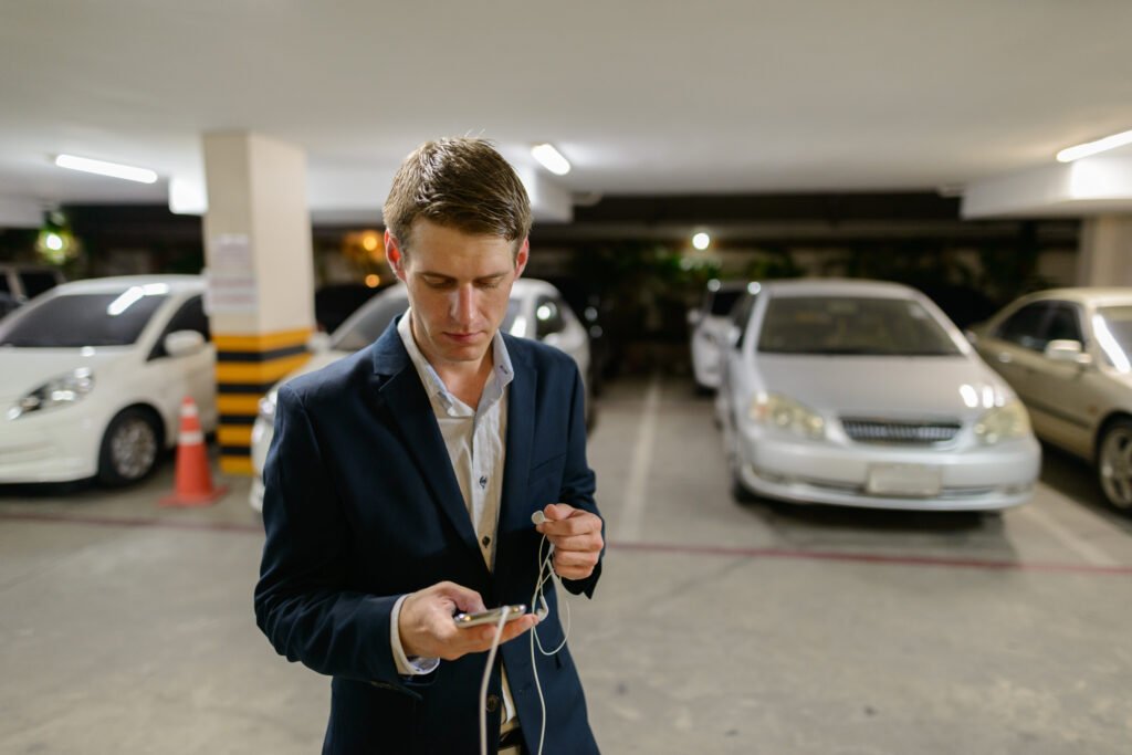 Young handsome businessman in the parking lot